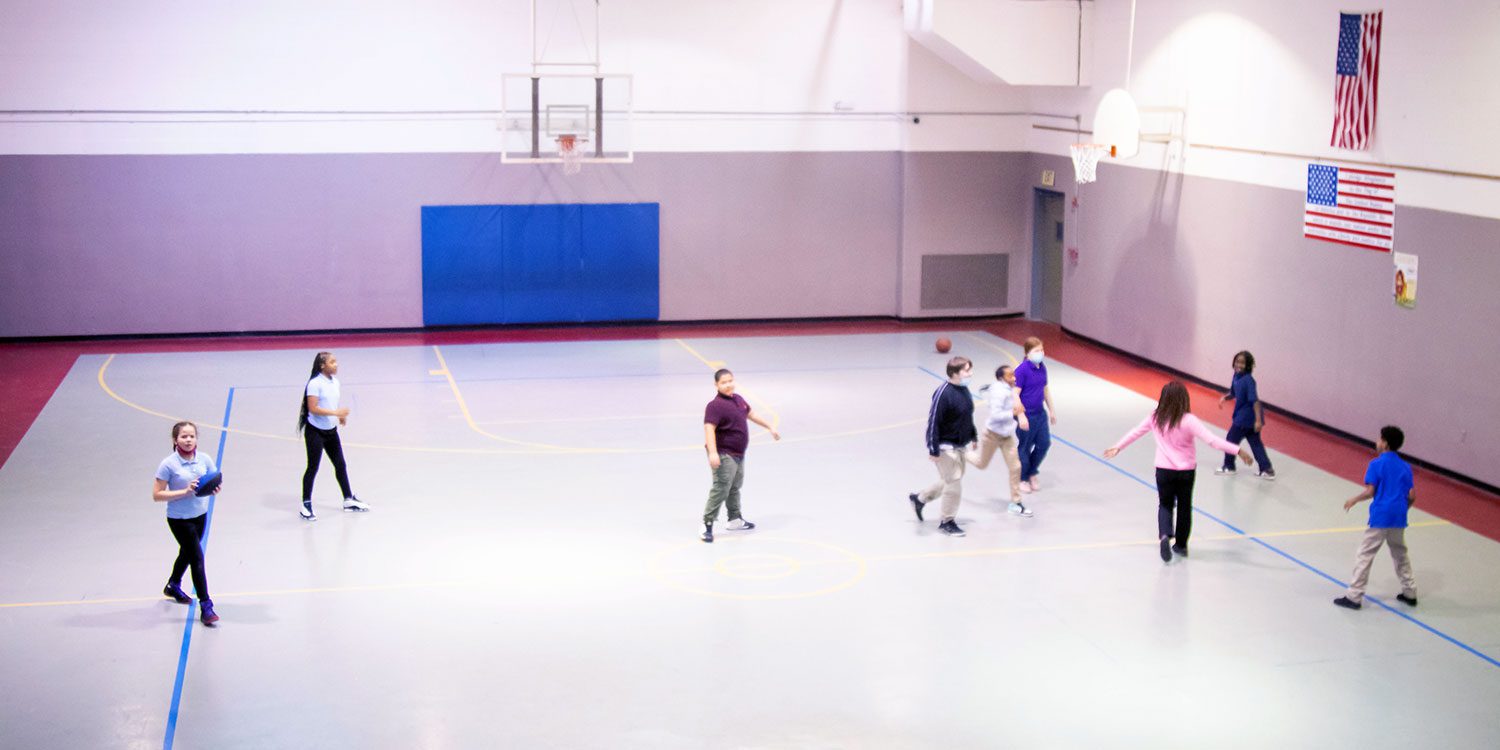 Middle school students in school gym class.