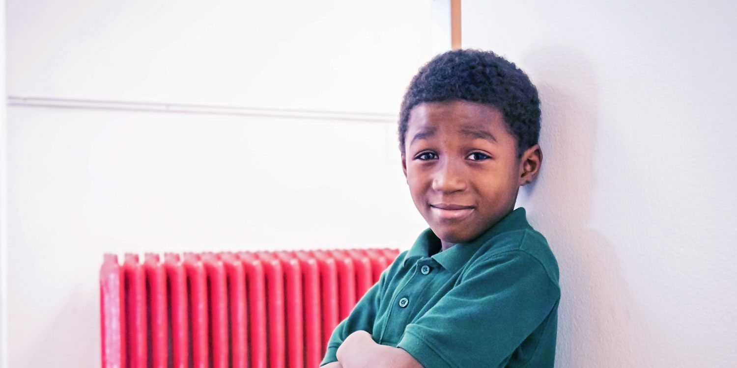 Smiling student in a classroom.