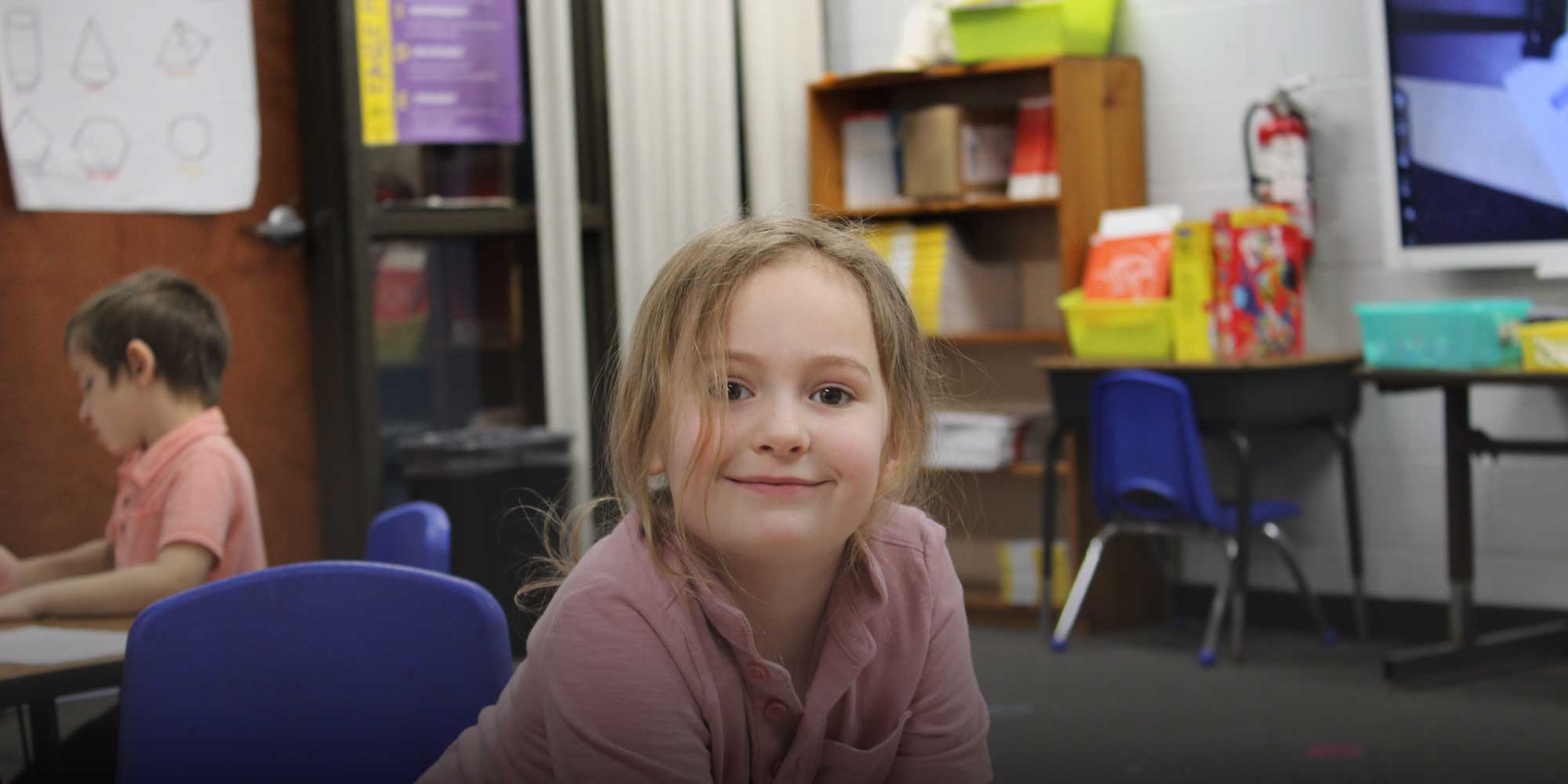 Smiling student in classroom