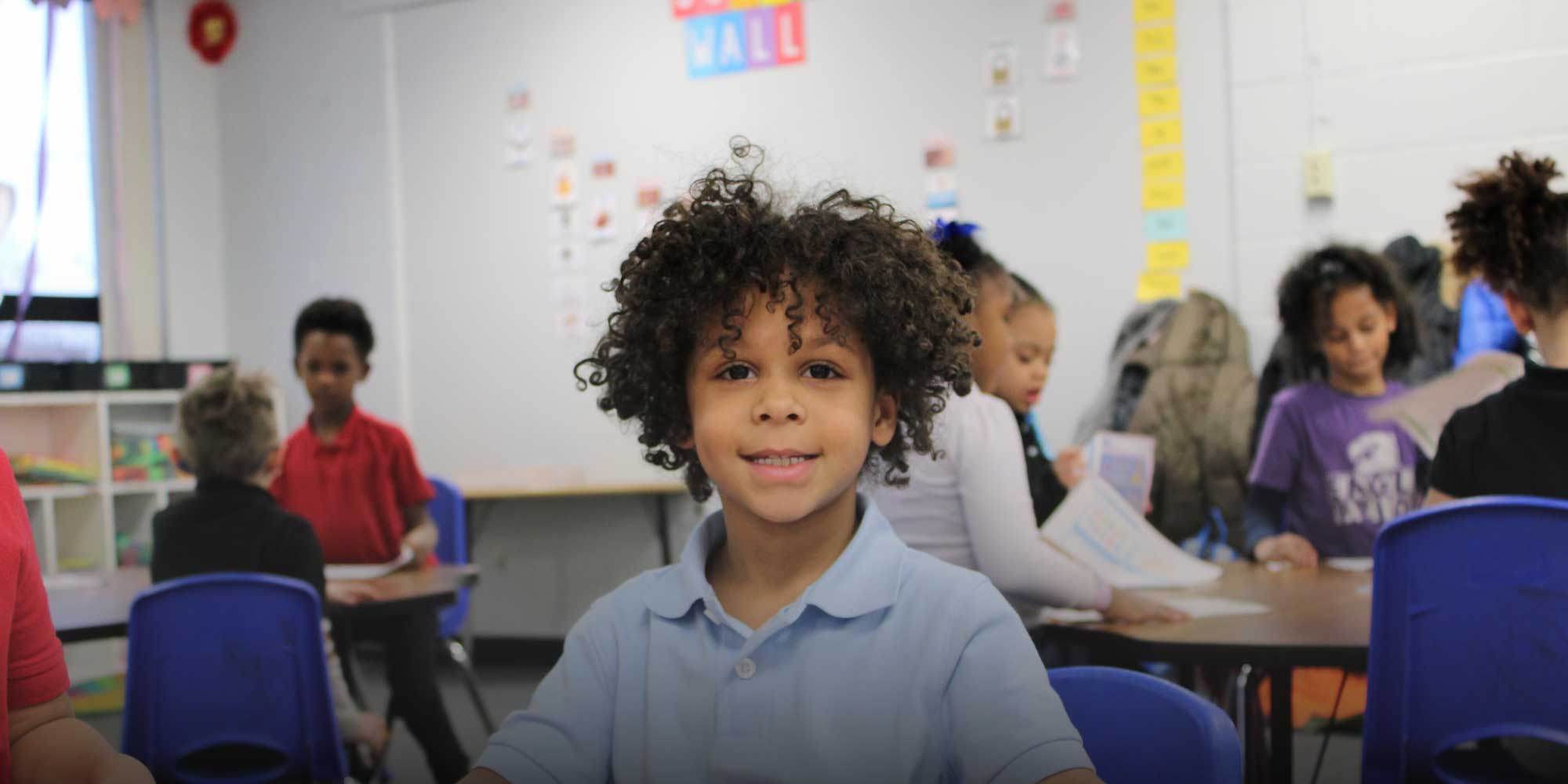 Smiling student sitting in class